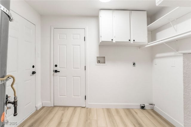 laundry area with cabinets, light hardwood / wood-style flooring, hookup for a washing machine, and hookup for an electric dryer