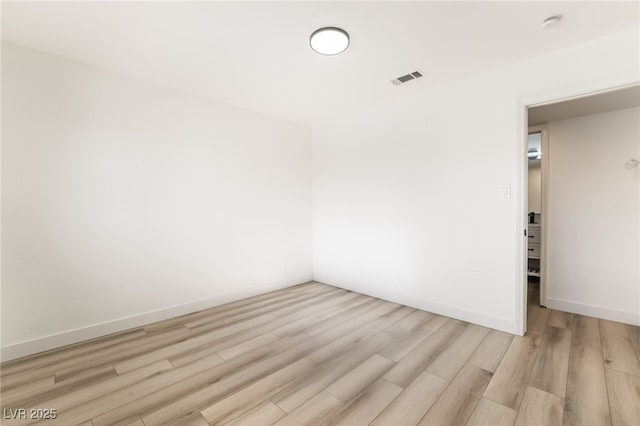 empty room with light wood-type flooring