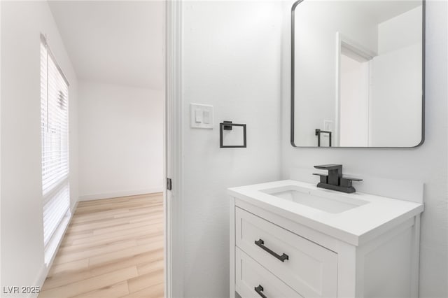 bathroom featuring vanity and hardwood / wood-style floors