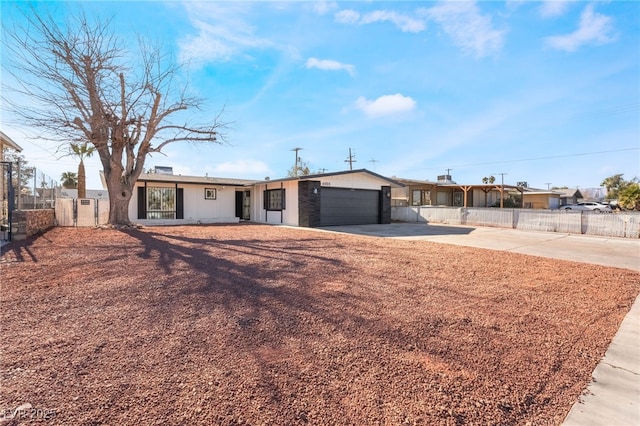 ranch-style house featuring a garage