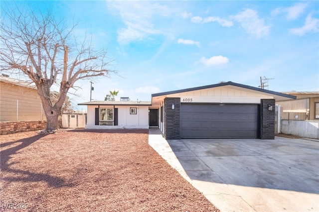 ranch-style house featuring a garage