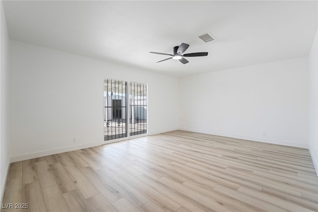 spare room with ceiling fan and light hardwood / wood-style flooring