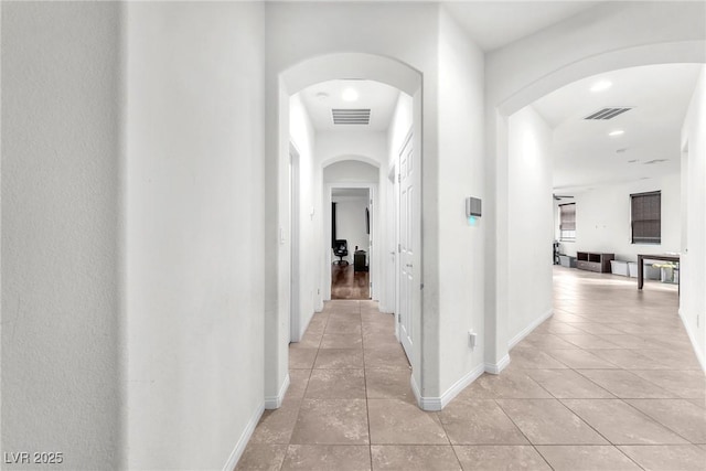 hallway with light tile patterned flooring