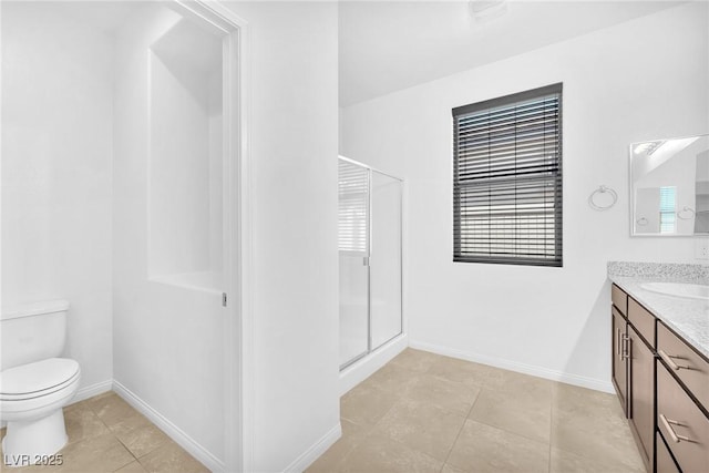 5640 Akula Bay St, North Las Vegas, NV 89081 - bathroom featuring vanity, a stall shower, toilet, and healthy amount of natural light