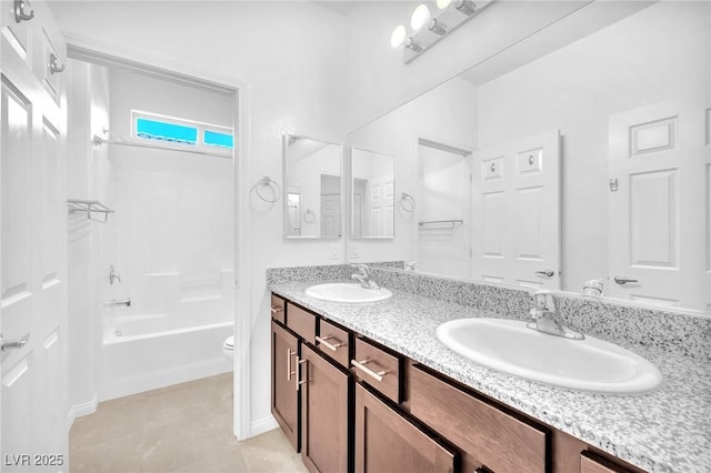 5640 Akula Bay St, North Las Vegas, NV 89081 - full bathroom featuring double vanity, toilet, tile patterned floors, and shower / bathtub combination