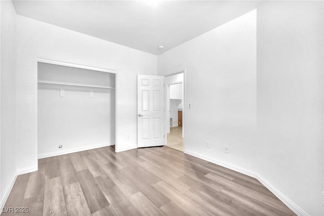 5640 Akula Bay St, North Las Vegas, NV 89081 - unfurnished bedroom featuring wood finished floors, a closet, and baseboards