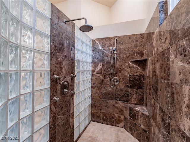 bathroom with tiled shower