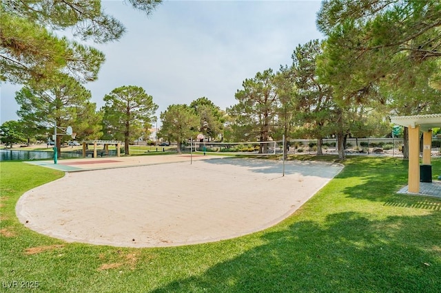 view of home's community featuring volleyball court and a lawn