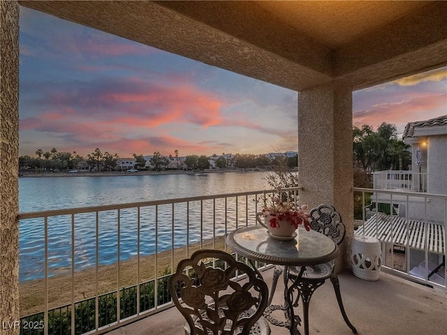 balcony at dusk with a water view