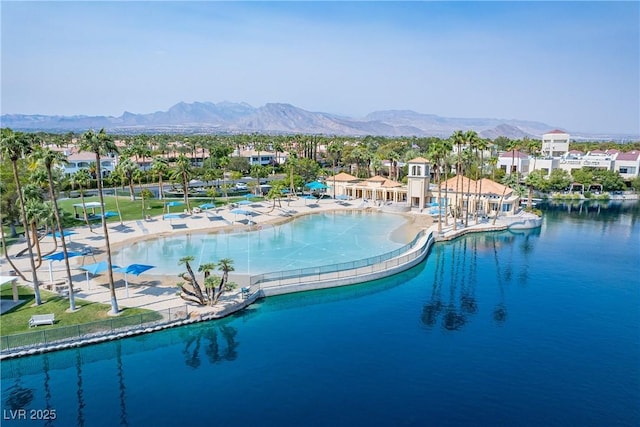 view of pool featuring a water and mountain view