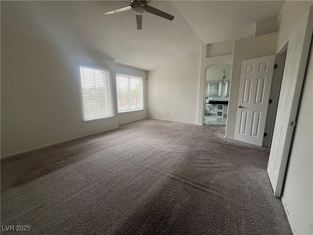 spare room with carpet floors and ceiling fan