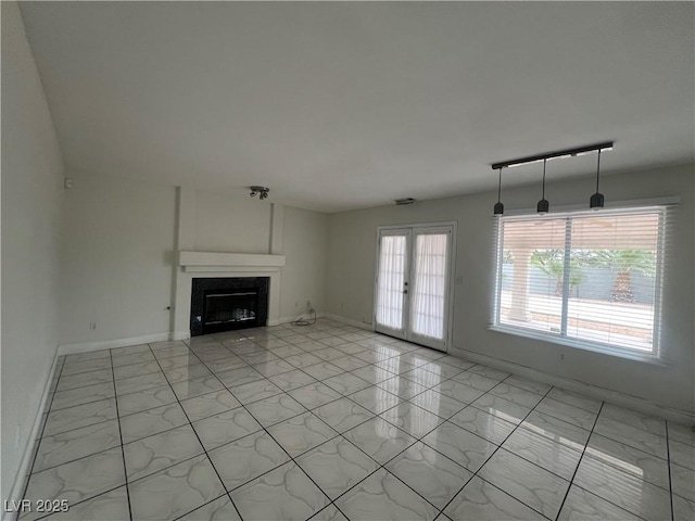 unfurnished living room with french doors