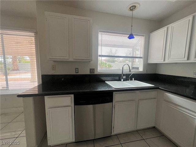 kitchen with light tile patterned floors, white cabinetry, stainless steel dishwasher, and sink