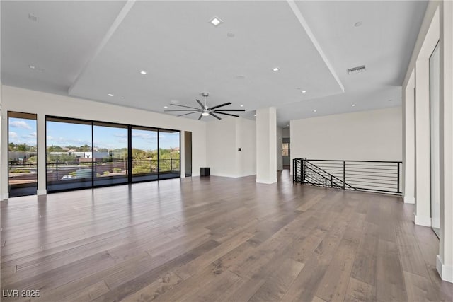 unfurnished living room featuring ceiling fan and light hardwood / wood-style flooring