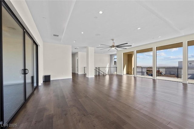 unfurnished room with ceiling fan and dark hardwood / wood-style floors