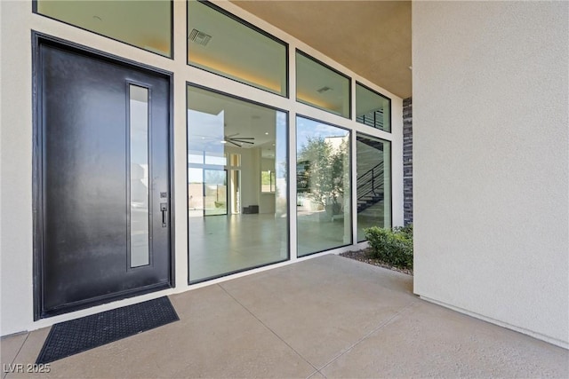 doorway to property featuring a patio