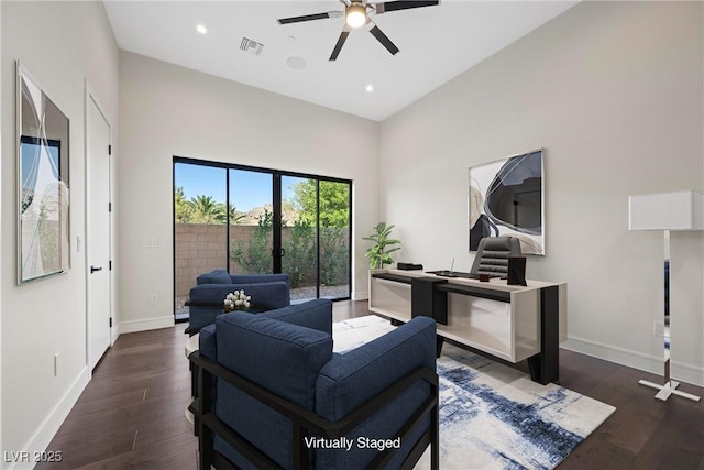 living room with ceiling fan and dark hardwood / wood-style floors