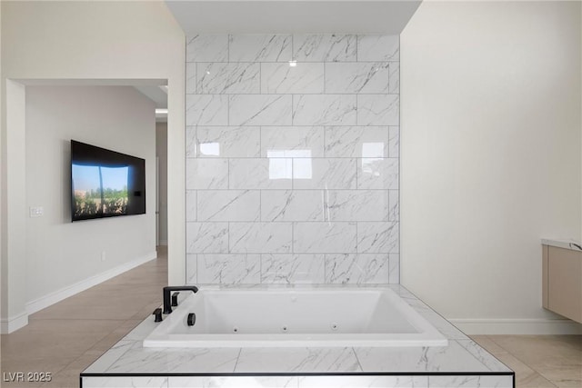 bathroom with tiled bath and vanity