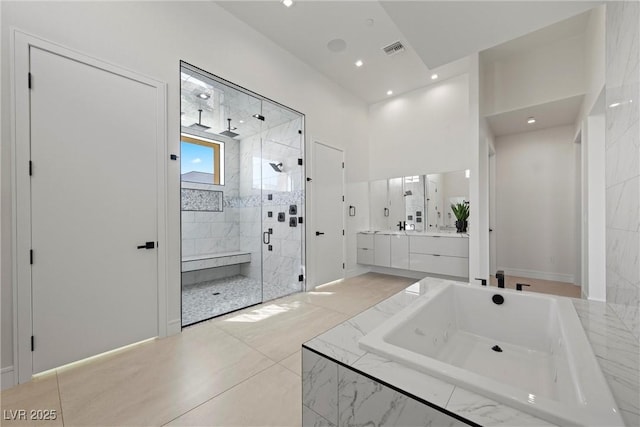 bathroom with vanity and plus walk in shower