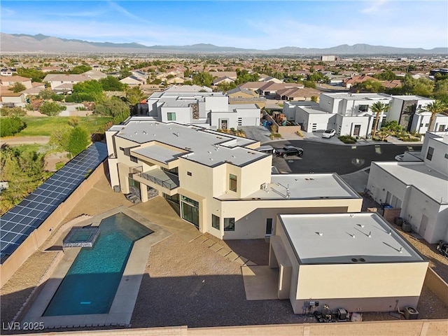 birds eye view of property with a mountain view