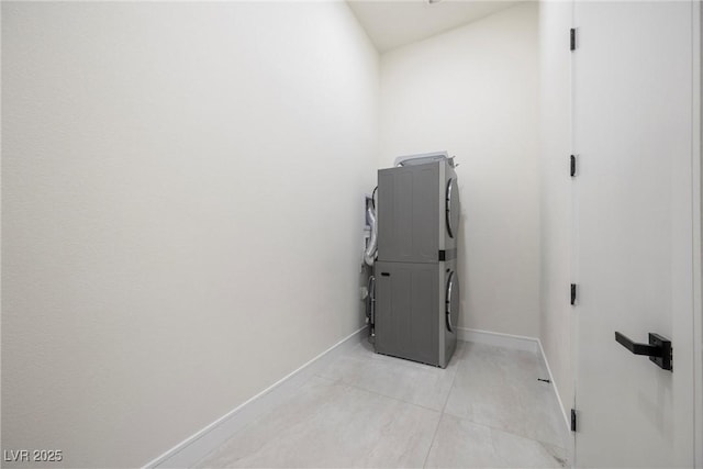 utility room featuring stacked washing maching and dryer