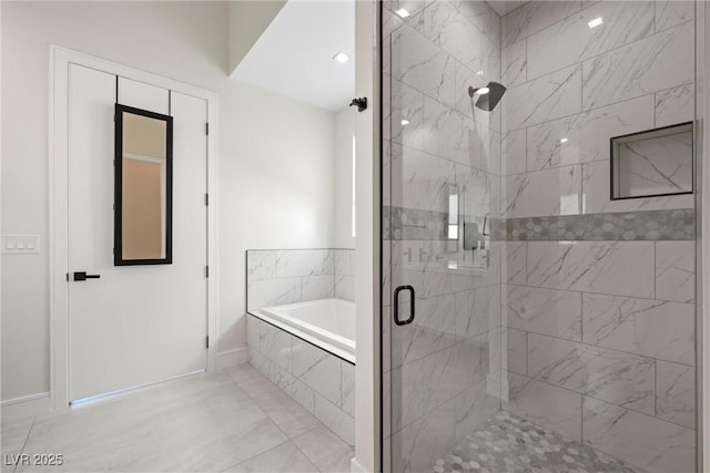 bathroom with separate shower and tub