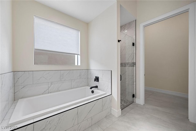 bathroom featuring separate shower and tub and tile patterned flooring