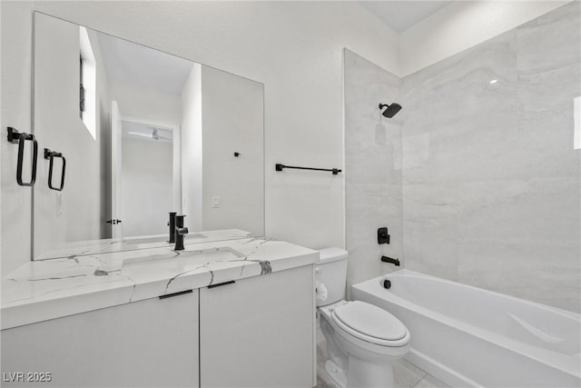 full bathroom featuring toilet, vanity, and bathing tub / shower combination