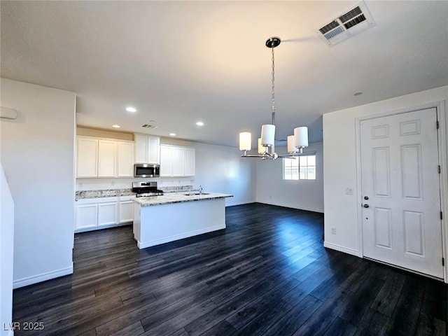 846 Star Estates Ave, North Las Vegas, NV 89086 - kitchen featuring stainless steel appliances, a chandelier, a sink, baseboards, and dark wood finished floors