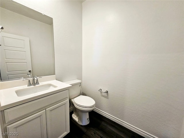 846 Star Estates Ave, North Las Vegas, NV 89086 - half bath featuring toilet, wood finished floors, vanity, and baseboards