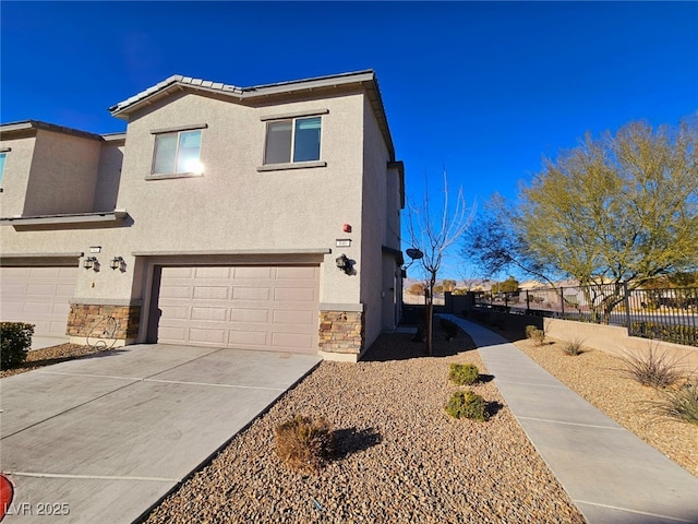 846 Star Estates Ave, North Las Vegas, NV 89086 - view of front of home with stone siding, stucco siding, and fence