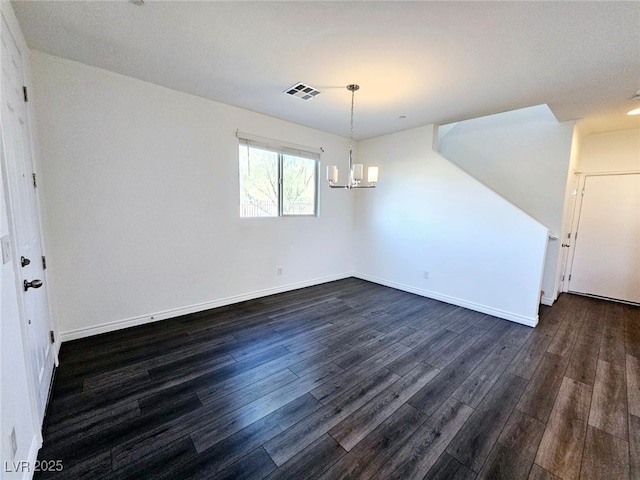 846 Star Estates Ave, North Las Vegas, NV 89086 - unfurnished dining area featuring dark wood-type flooring, a chandelier, and baseboards