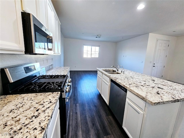 846 Star Estates Ave, North Las Vegas, NV 89086 - kitchen featuring appliances with stainless steel finishes, a sink, white cabinetry, dark wood-type flooring, and recessed lighting