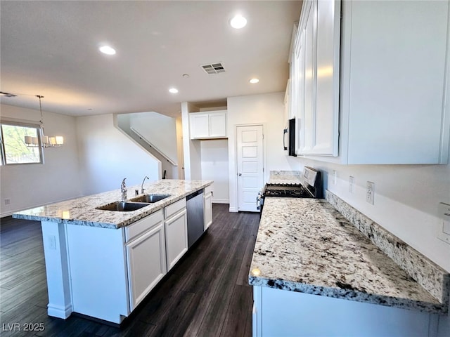 846 Star Estates Ave, North Las Vegas, NV 89086 - kitchen with appliances with stainless steel finishes, a sink, white cabinets, a chandelier, and recessed lighting