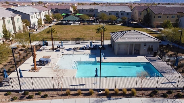 846 Star Estates Ave, North Las Vegas, NV 89086 - community pool with fence, a residential view, and a mountain view