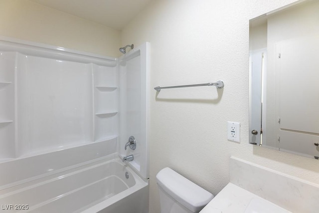 bathroom featuring toilet and tub / shower combination