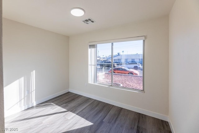 empty room featuring wood-type flooring