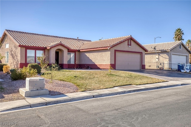 view of front of house with a garage and a front yard