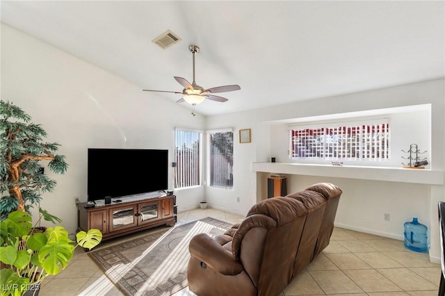 tiled living room with ceiling fan