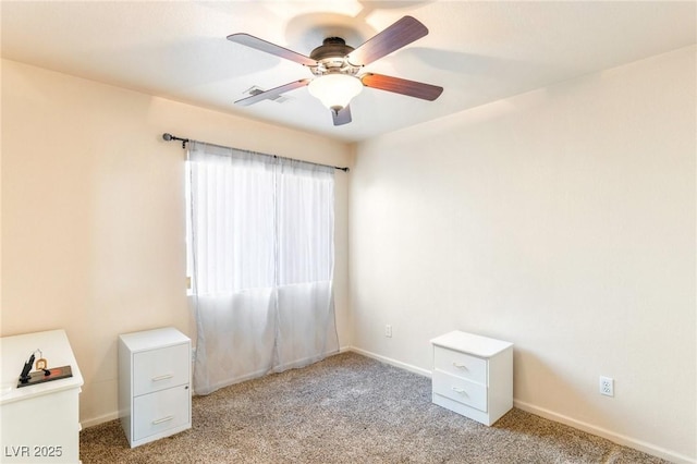 carpeted empty room with ceiling fan