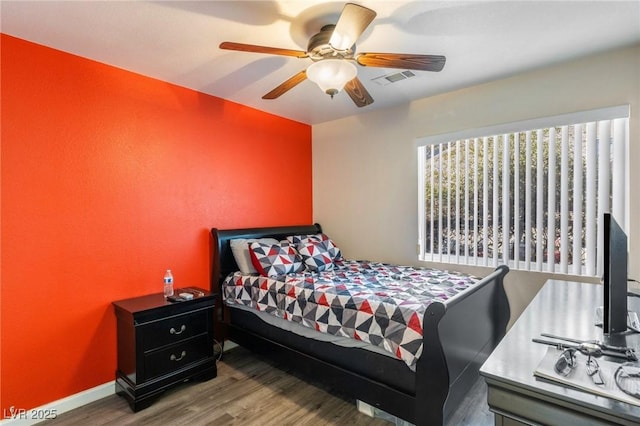 bedroom featuring ceiling fan and hardwood / wood-style floors