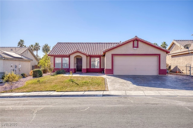 view of front of home with a front lawn and a garage