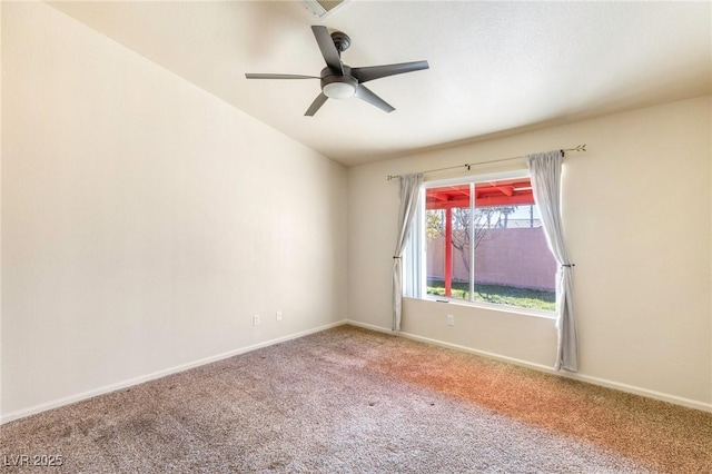 carpeted empty room with ceiling fan and lofted ceiling