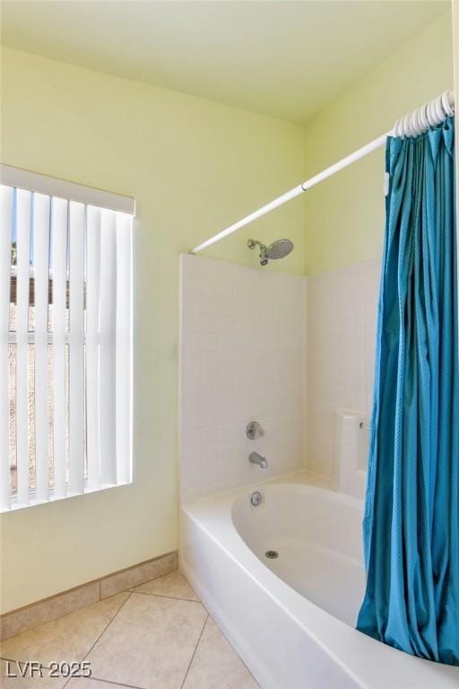 bathroom featuring tile patterned flooring and shower / bath combination with curtain