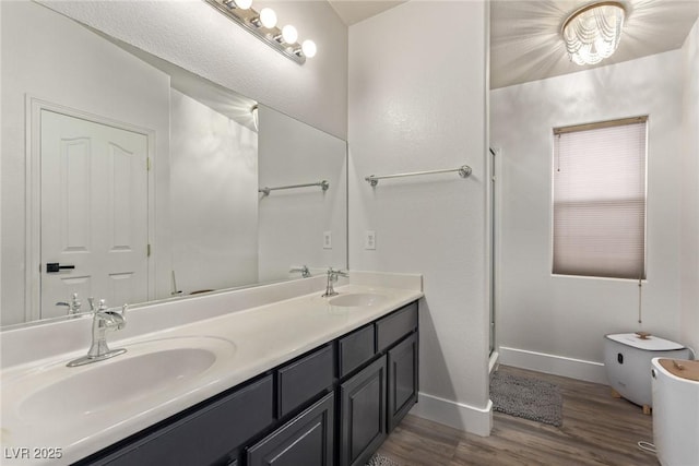 bathroom featuring vanity and hardwood / wood-style flooring