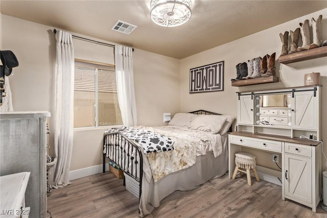 bedroom with hardwood / wood-style floors