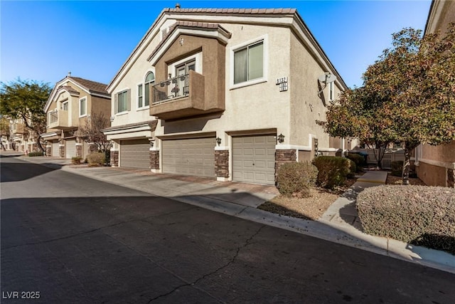 multi unit property featuring a garage