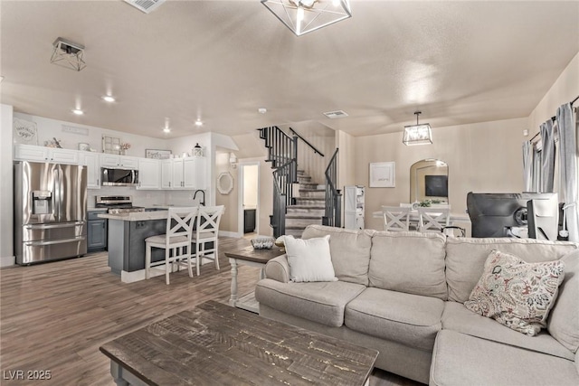 living room with dark wood-type flooring