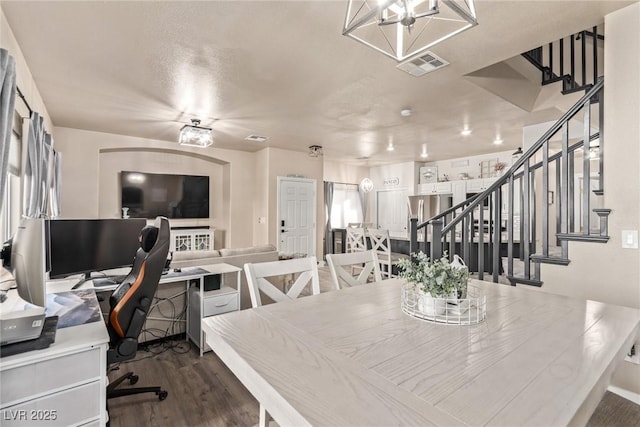 dining area with dark hardwood / wood-style flooring