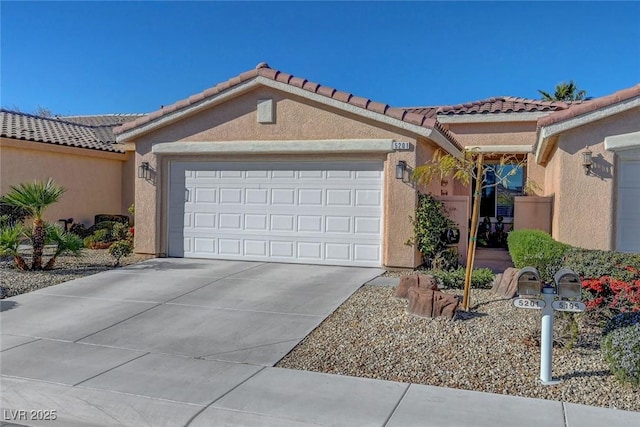 view of front of house with stucco siding, driveway, and a garage